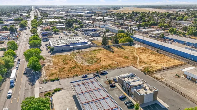 an aerial view of a city with swimming pool and ocean view