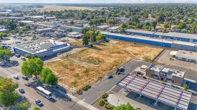 an aerial view of a residential building with lake view
