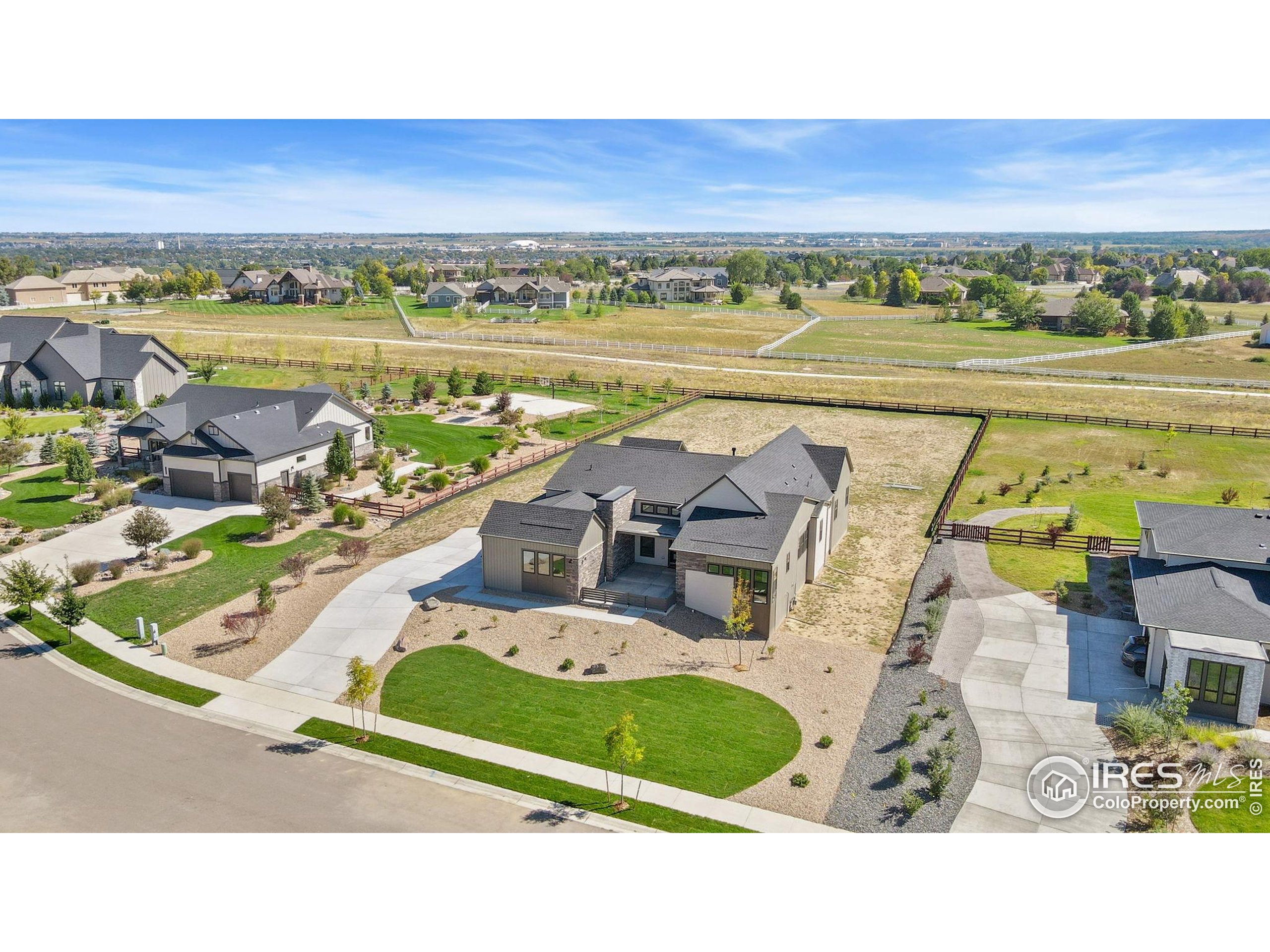 1889 Spring Bloom Drive Windsor, CO 80550 - Photo 24 of 32 a view of swimming pool with a table and chairs