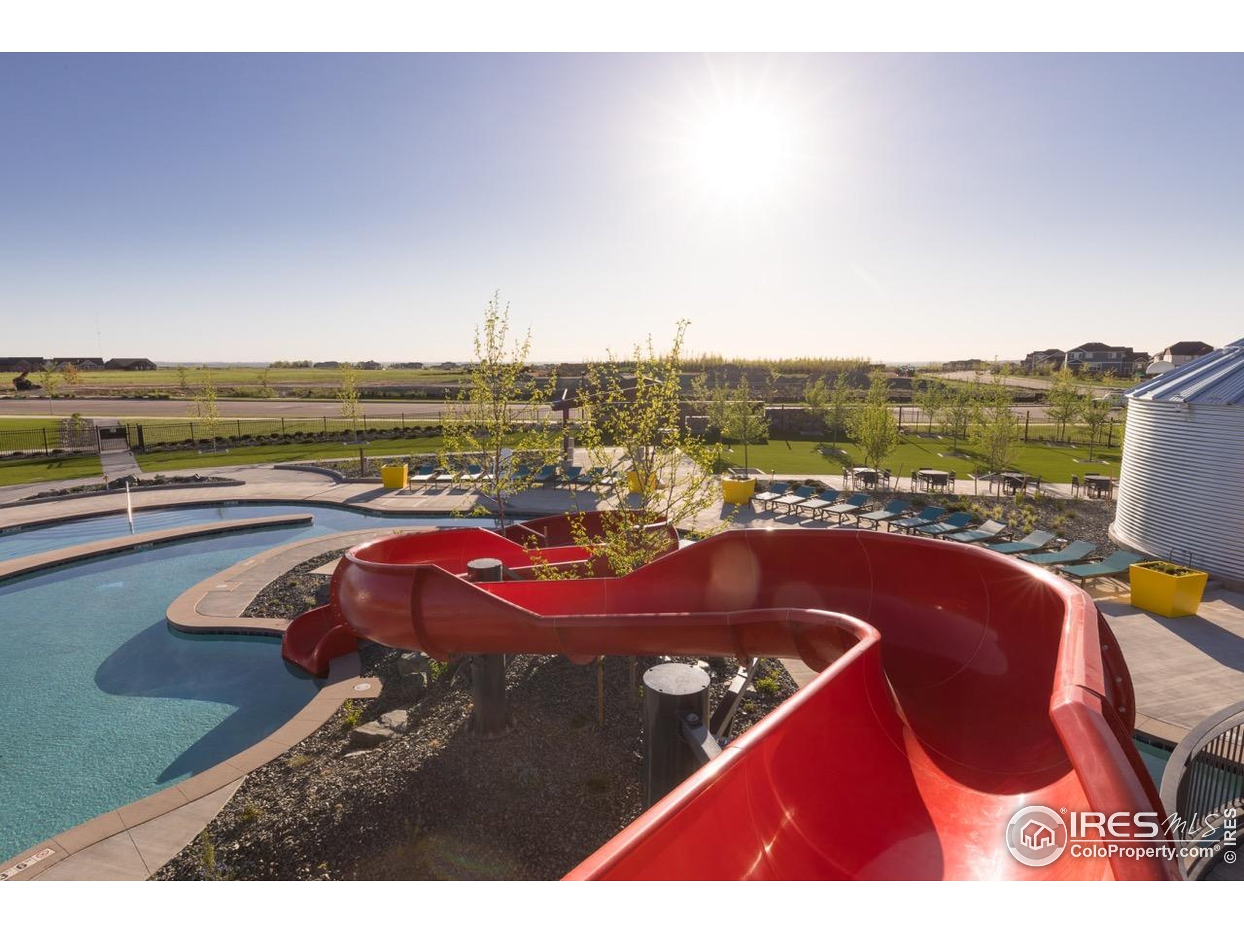 1889 Spring Bloom Drive Windsor, CO 80550 - Photo 29 of 32 a view of swimming pool with outdoor seating