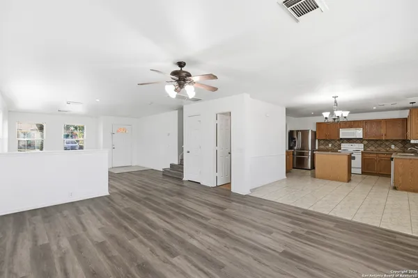 a view of a kitchen with a sink and a microwave