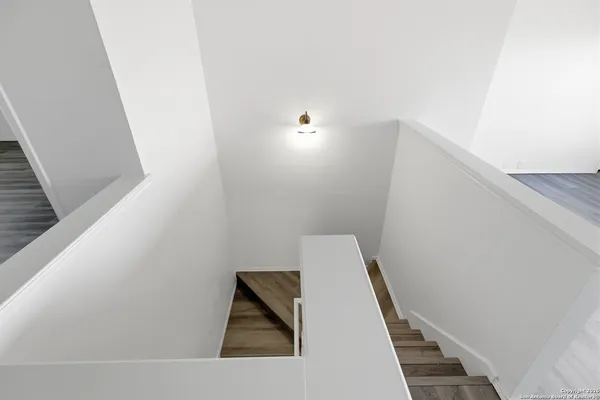 a view of a kitchen with a sink and a window