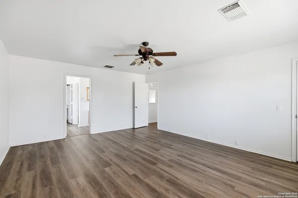 a bathroom with a double vanity sink mirror and shower
