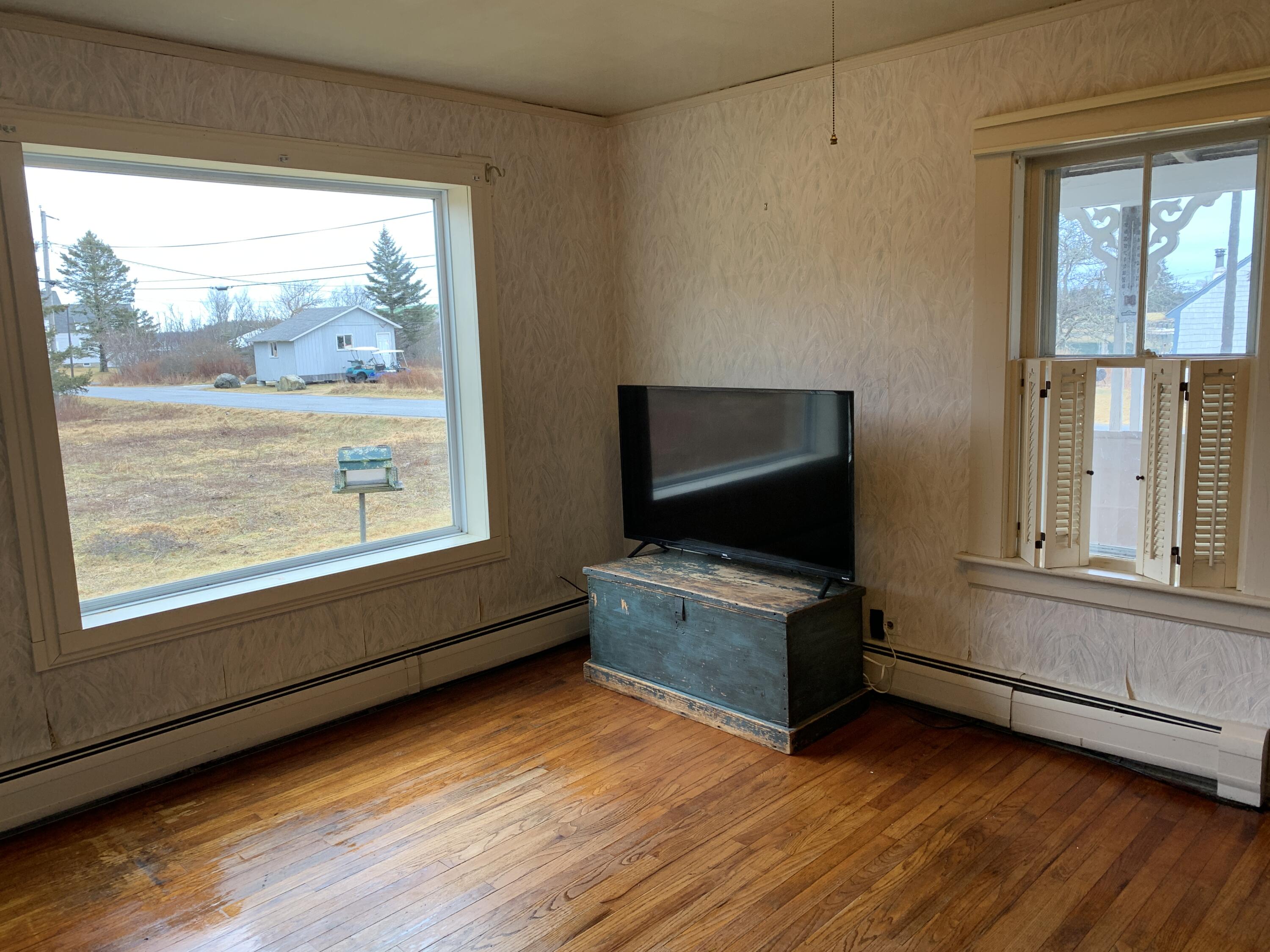 30 Dog Point Road Cranberry Isles, ME 04625 - Photo 3 of 14 Living room with hard wood floors