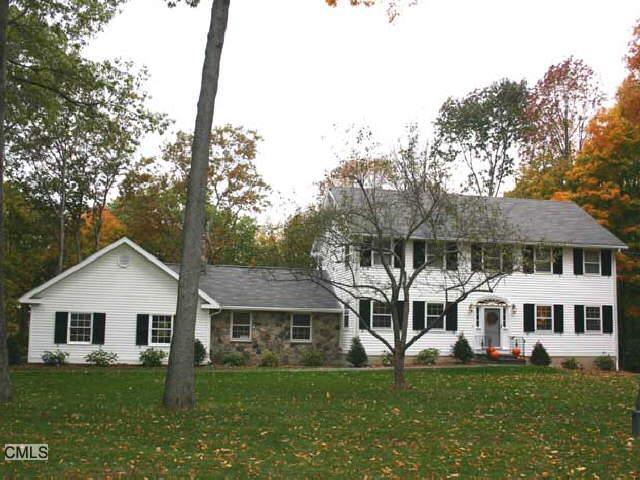 10 Revere Place Ridgefield, CT 06877 - Photo 1 of 1 a front view of a house with a garden