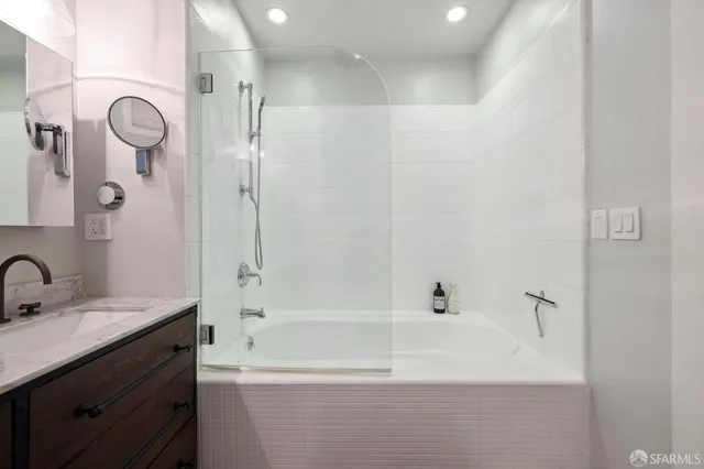 a bathroom with a bathtub and a sink