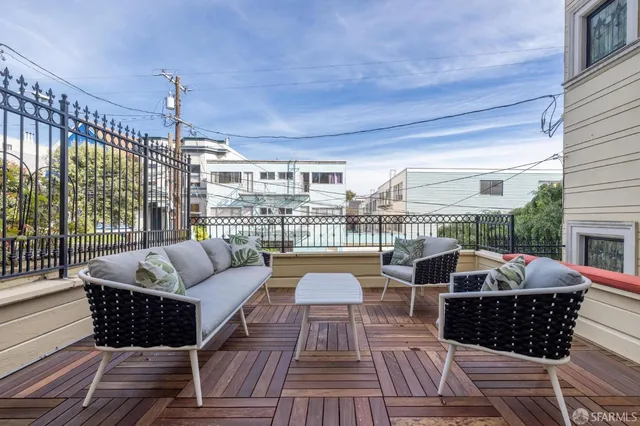 a living room with furniture fireplace and a table