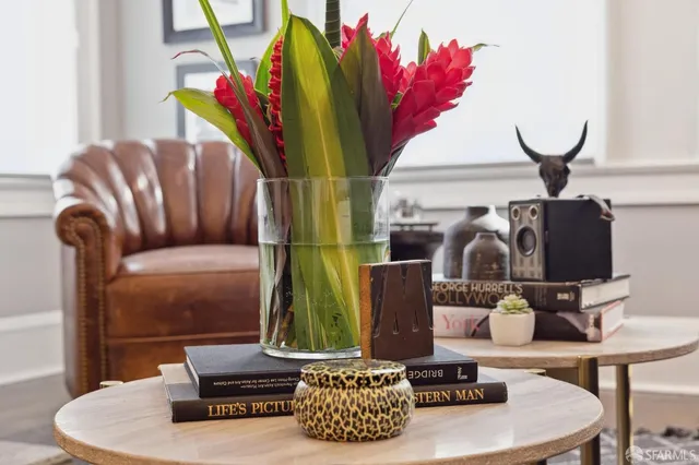 a living room with furniture and a potted plant