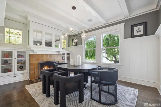 a dining room with furniture and window