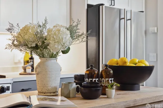 a living room with furniture and potted plant