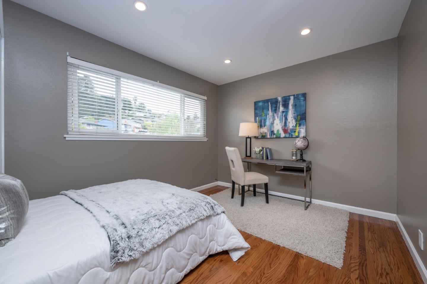 3 Yellowstone Way Pacifica, CA 94044 - Photo 12 of 18 a bedroom with a bed and a desk