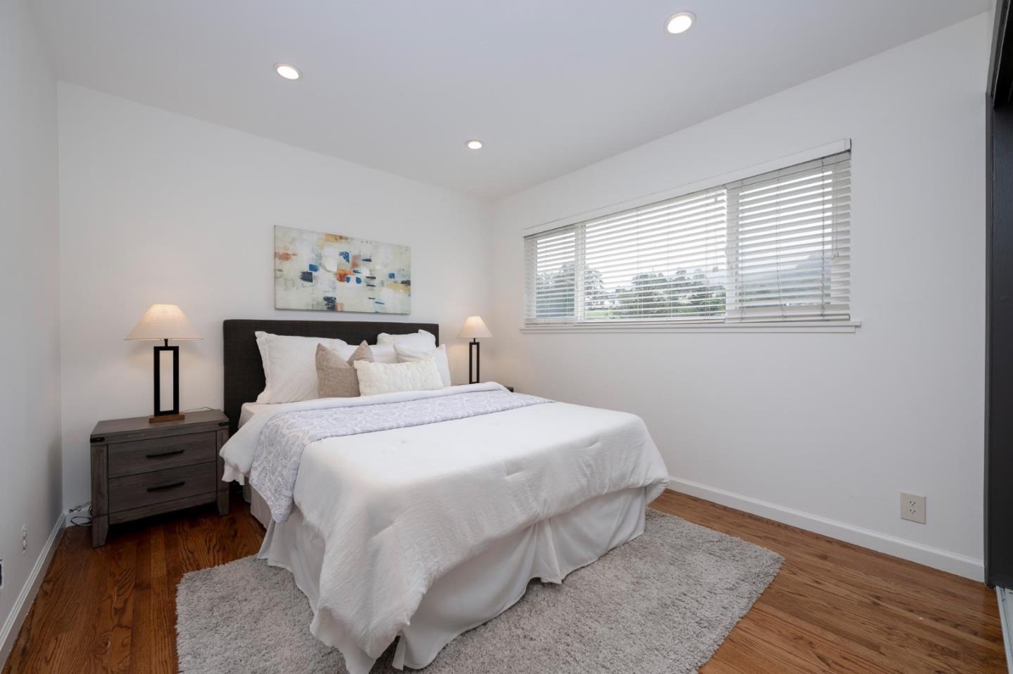 3 Yellowstone Way Pacifica, CA 94044 - Photo 15 of 18 a bedroom with a bed and a night stand