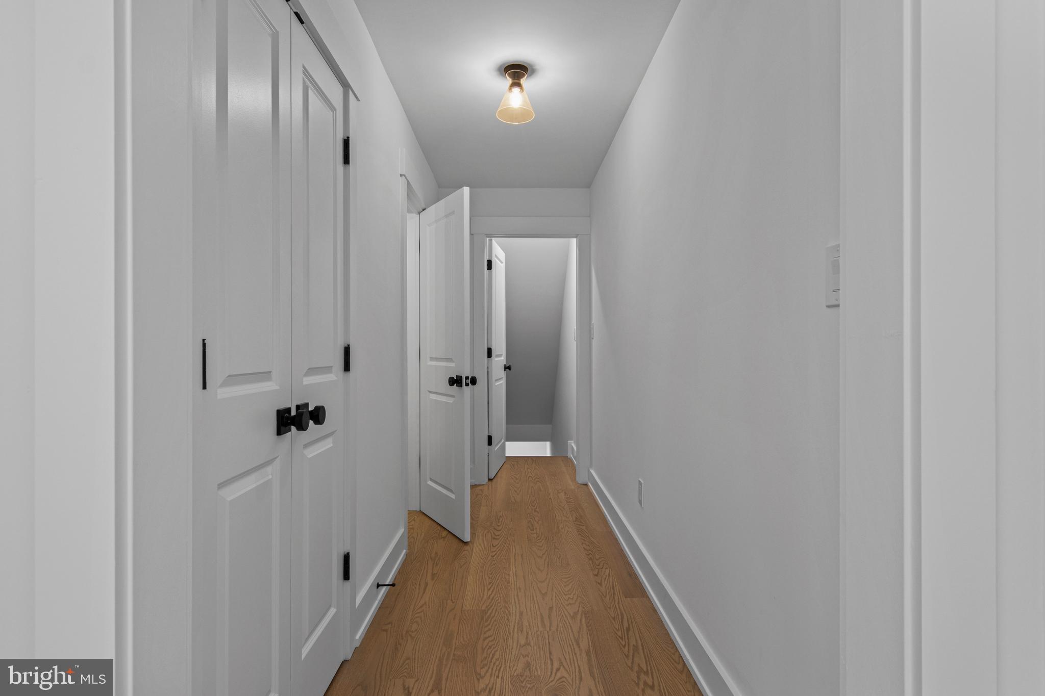 142 Merion Avenue Narberth, PA 19072 - Photo 27 of 67 hallway to pantry, lower level door, half bath