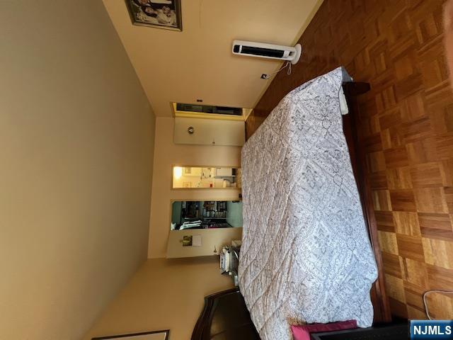 2 Horizon Road, Unit 1423 Fort Lee, NJ 07024 - Photo 16 of 30 a bedroom with a bed and chair