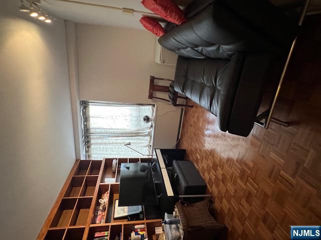 2 Horizon Road, Unit 1423 Fort Lee, NJ 07024 - Photo 20 of 30 a living room with furniture and a flat screen tv