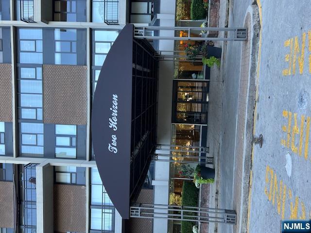 2 Horizon Road, Unit 1423 Fort Lee, NJ 07024 - Photo 30 of 30 a front view of a building with street