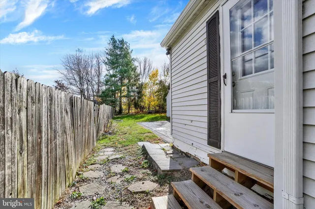 a view of a backyard with chairs