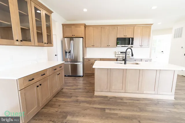 a kitchen with a sink and a window