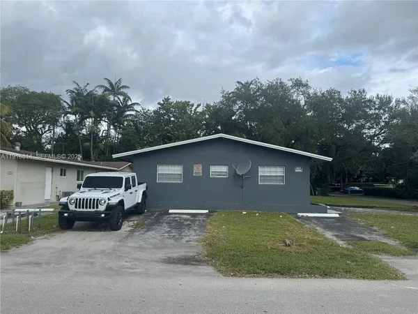 a car parked in front of a house
