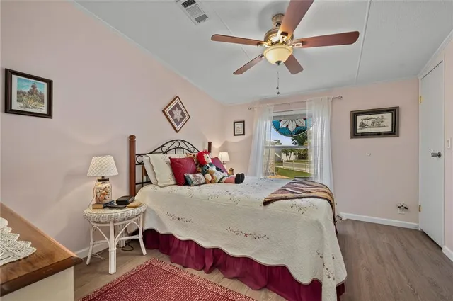 a bathroom with a granite countertop sink a toilet and a shower