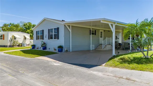 a aerial view of a house with swimming pool garden and patio