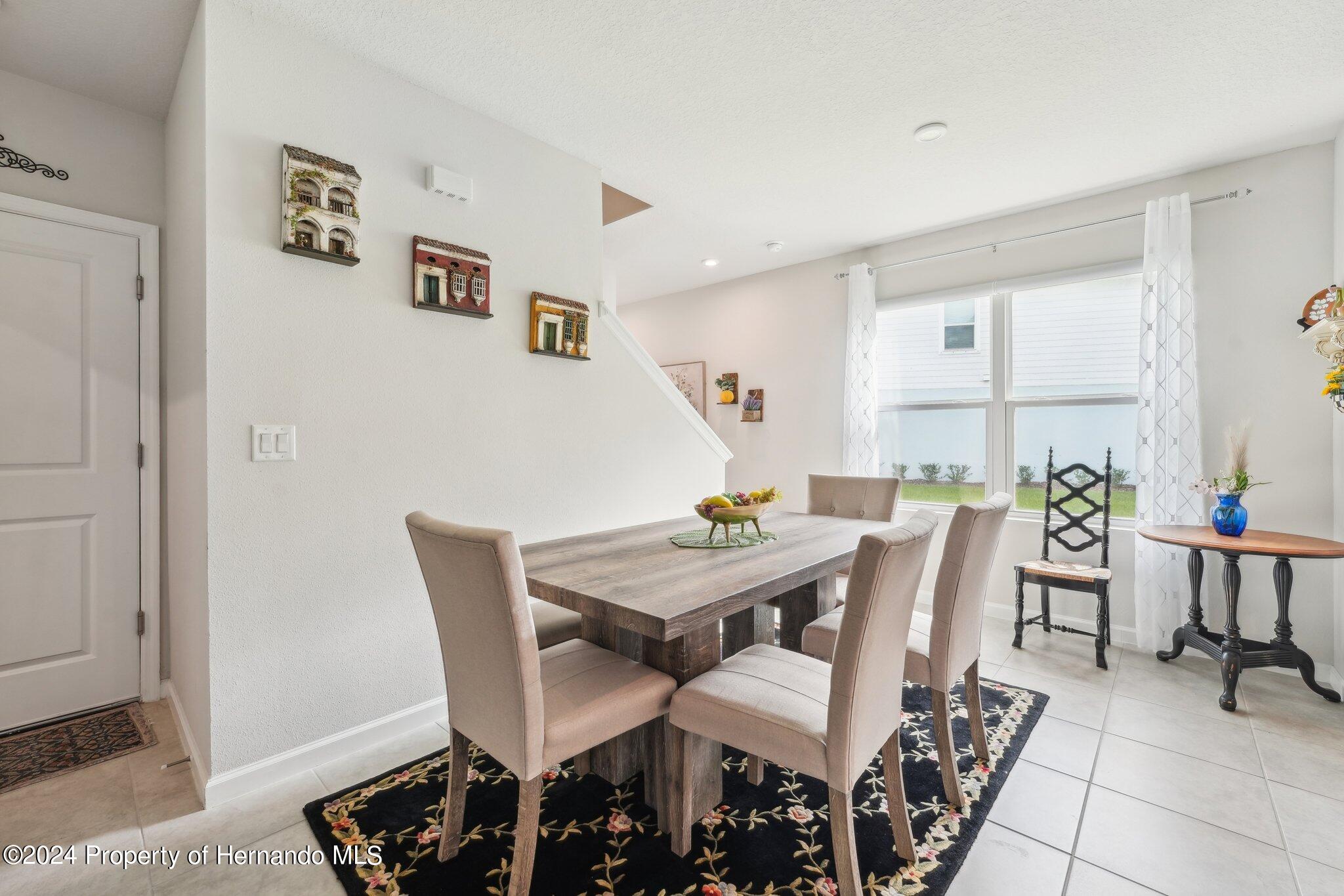 12214 Grizzly Lane New Port Richey, FL 34654 - Photo 11 of 49 a view of a dining room with furniture