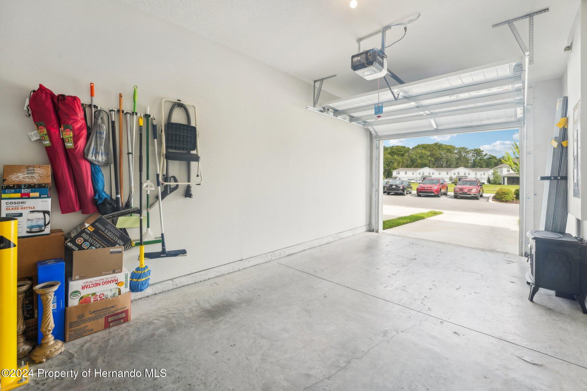 12214 Grizzly Lane New Port Richey, FL 34654 - Photo 42 of 49 a view of walk in closet with clothes and shoes