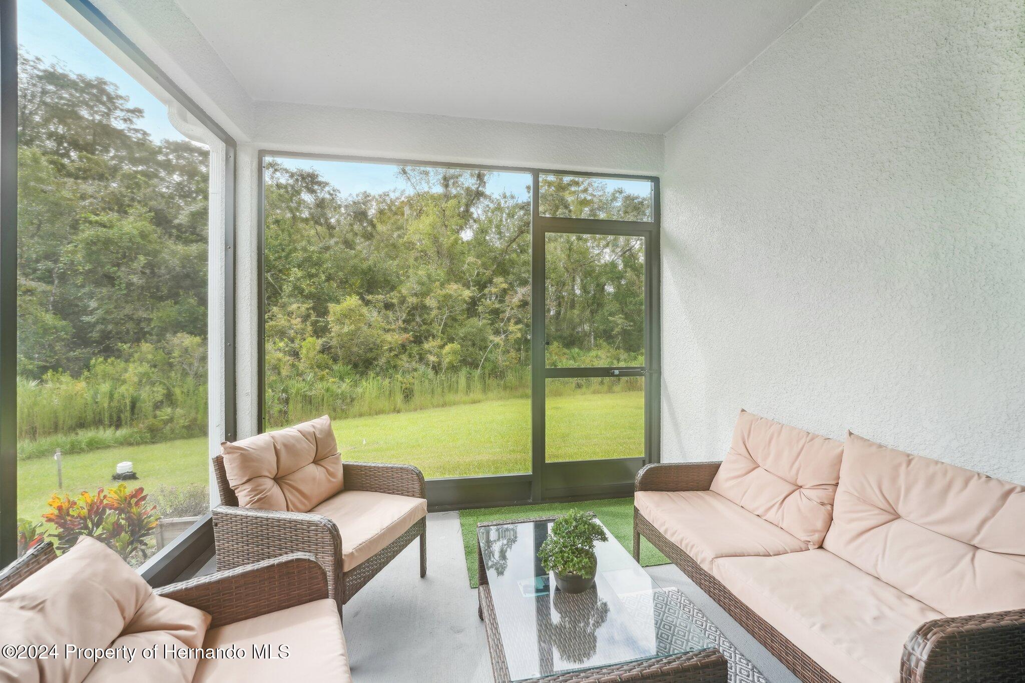 12214 Grizzly Lane New Port Richey, FL 34654 - Photo 44 of 49 a living room with furniture and a large window