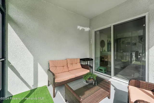 a outdoor living space with furniture and a potted plant