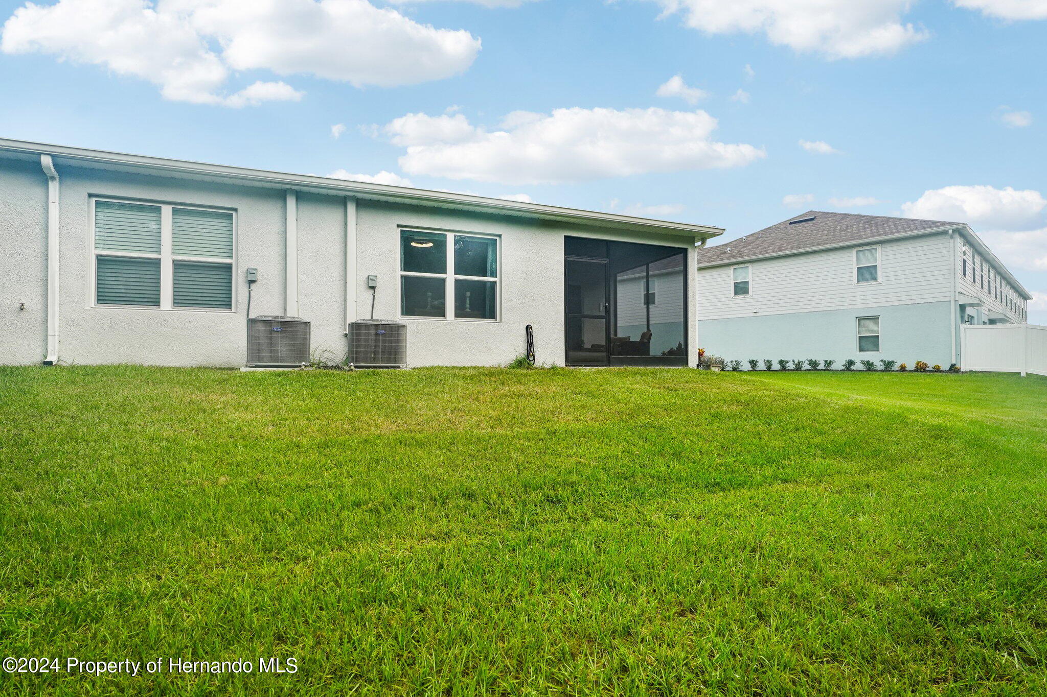 12214 Grizzly Lane New Port Richey, FL 34654 - Photo 46 of 49 a view of a house with a yard and sitting area