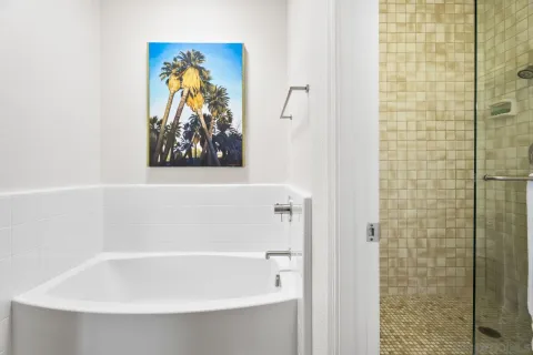 a spacious bedroom with a bed and a couch