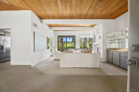a view of living room with furniture and window