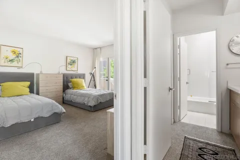 a bedroom with a bed and a couch