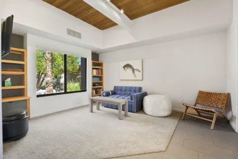 a living room with furniture and white furniture
