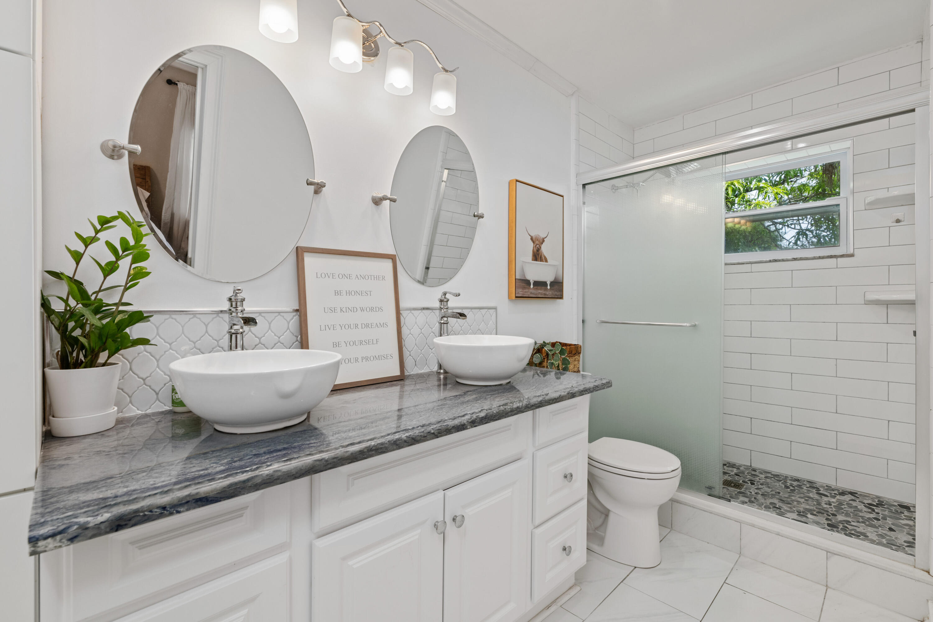 4534 County Line Road Tequesta, FL 33469 - Photo 11 of 26 a bathroom with a granite countertop sink mirror and toilet