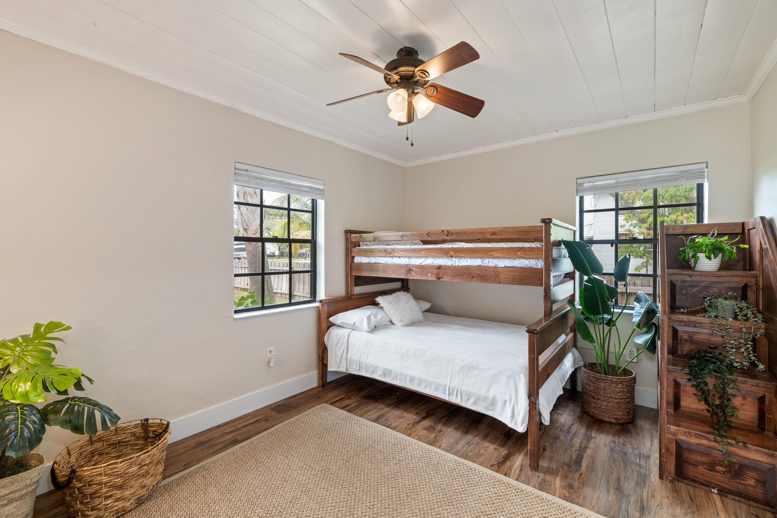 4534 County Line Road Tequesta, FL 33469 - Photo 13 of 26 a bedroom with furniture and a window