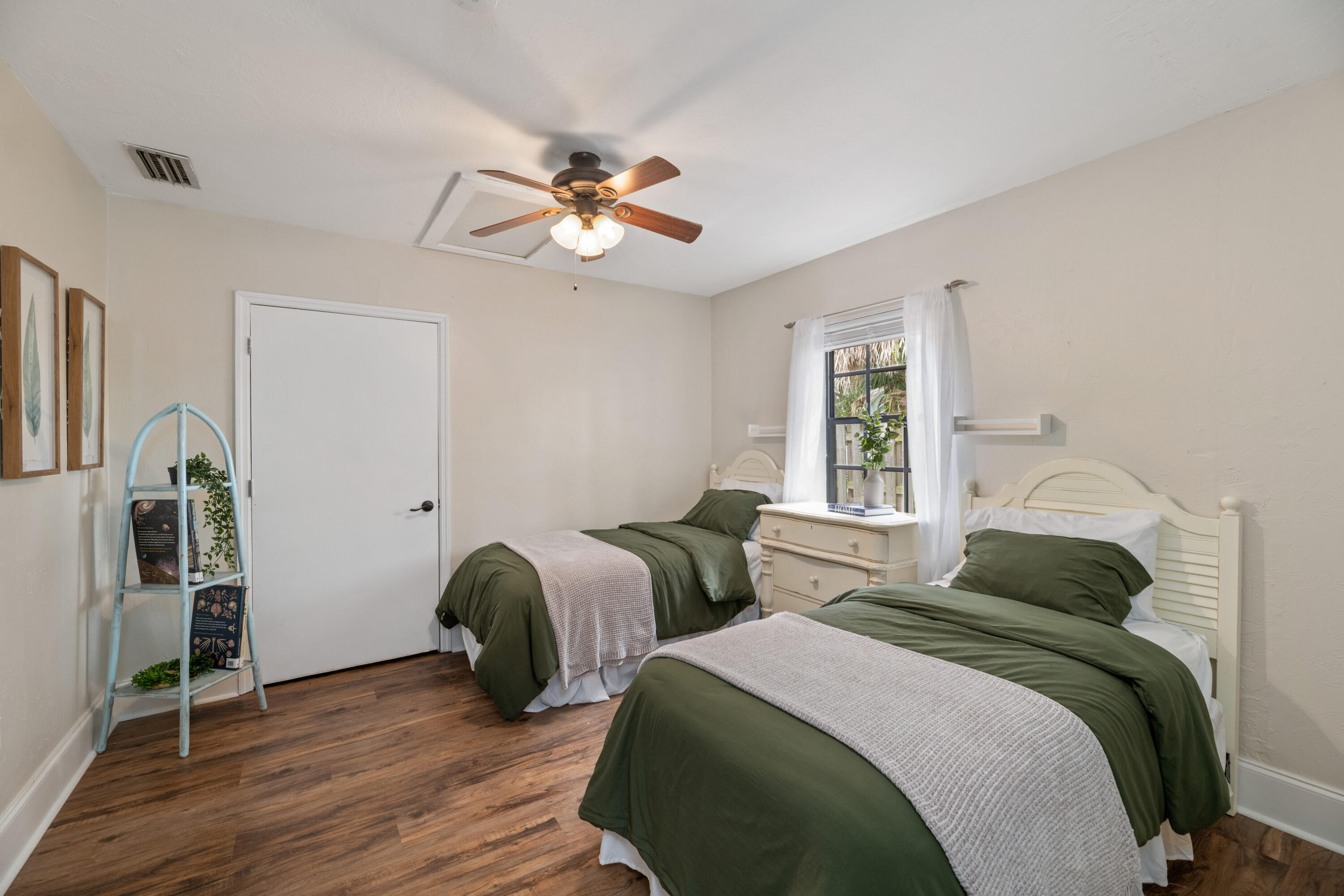 4534 County Line Road Tequesta, FL 33469 - Photo 18 of 26 a bedroom with two beds and wooden floor