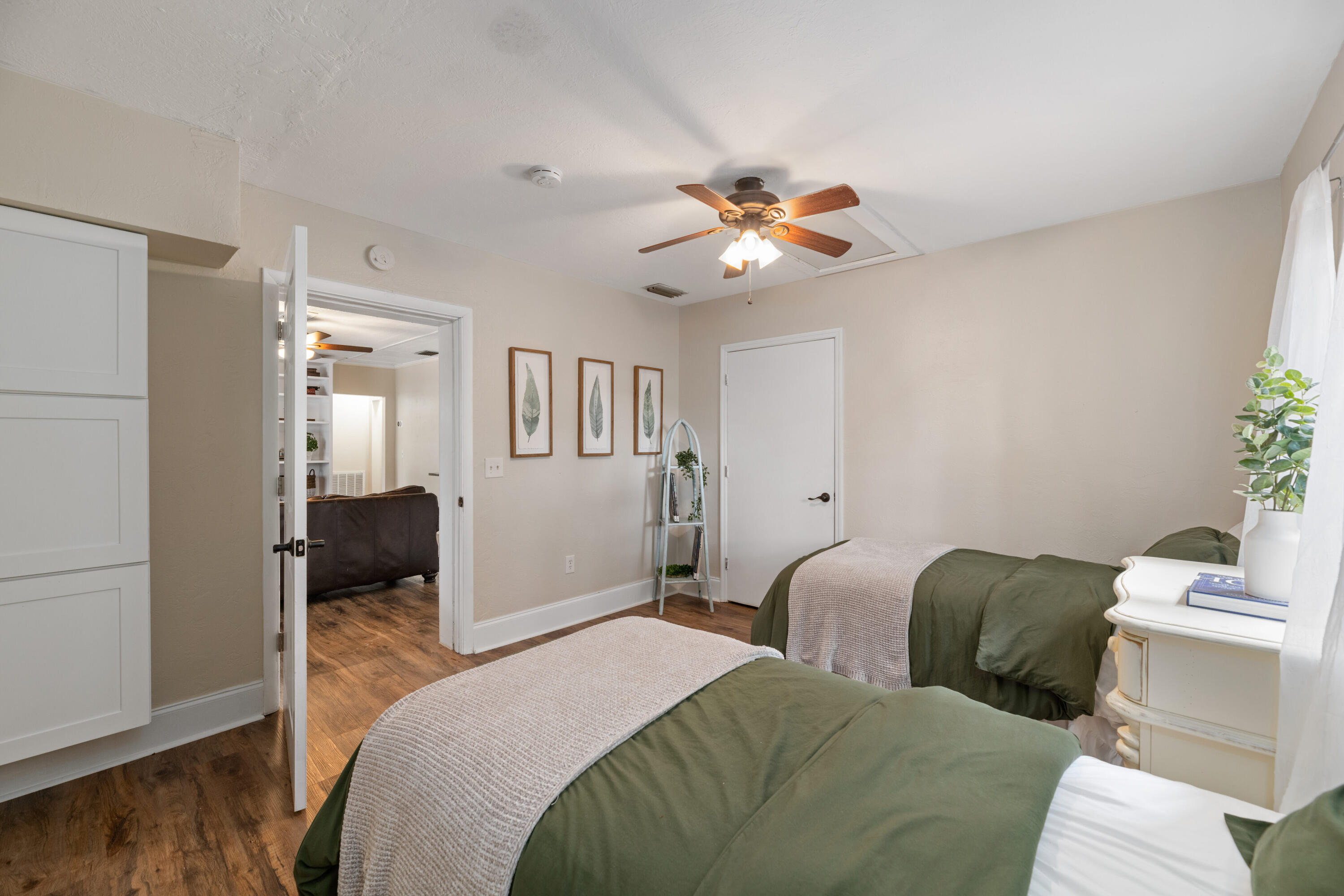 4534 County Line Road Tequesta, FL 33469 - Photo 19 of 26 a bedroom with a bed and wooden floor