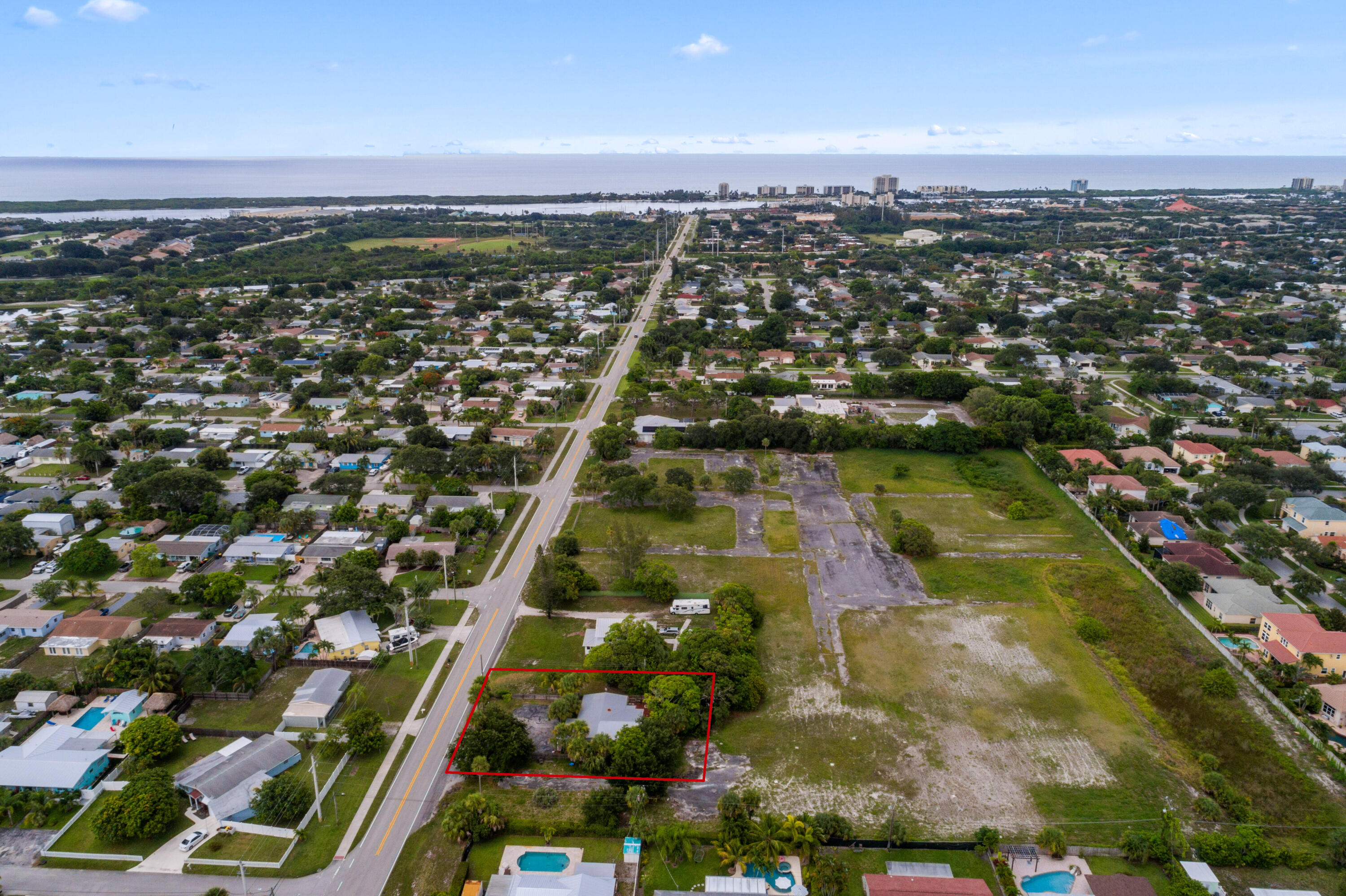 4534 County Line Road Tequesta, FL 33469 - Photo 24 of 26 an aerial view of residential houses with outdoor space