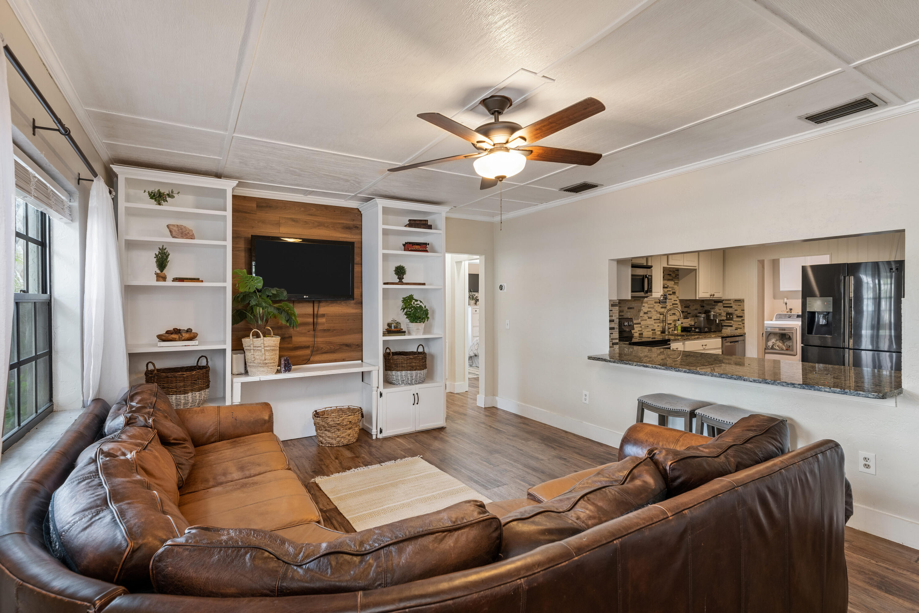 4534 County Line Road Tequesta, FL 33469 - Photo 8 of 26 a living room with furniture and a large window