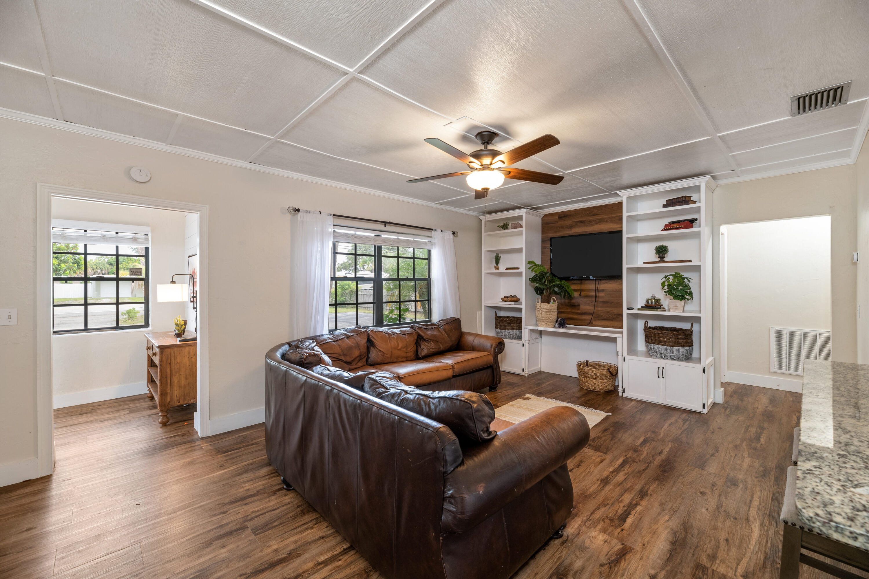 4534 County Line Road Tequesta, FL 33469 - Photo 9 of 26 a living room with furniture fireplace and a flat screen tv