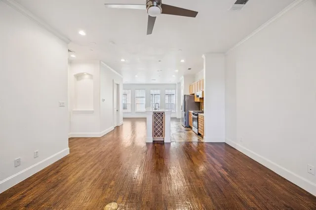 a view of a kitchen with wooden floor and a kitchen