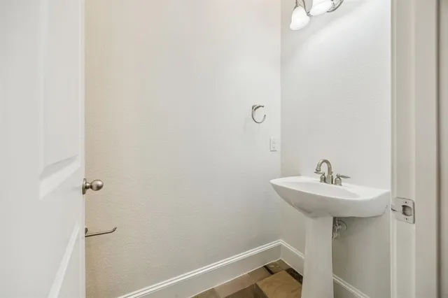 a bathroom with a sink a mirror and a shower