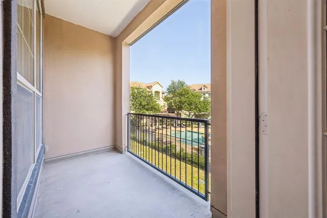 a view of a room that has a large window