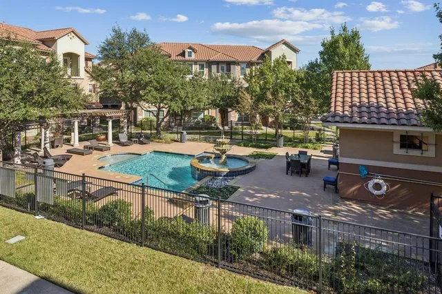 an aerial view of a house with outdoor space