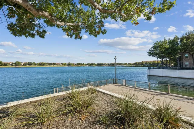 a view of a swimming pool with an outdoor seating