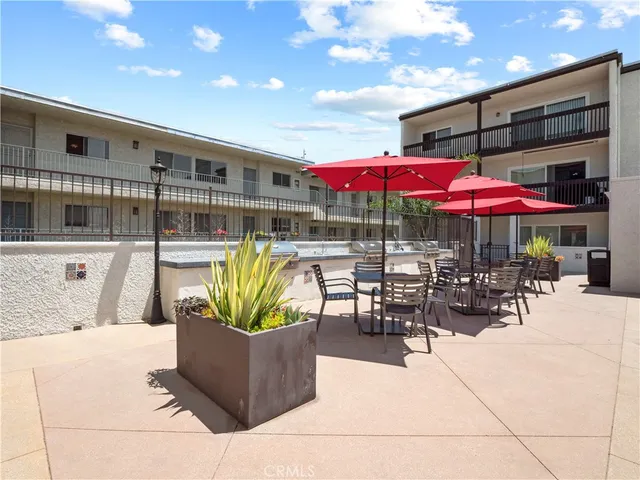 a view of a patio with swimming pool table and chairs
