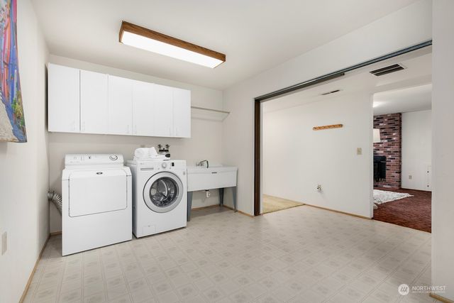 a utility room with dryer and washer