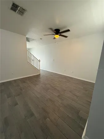 a view of walk in closet with empty racks