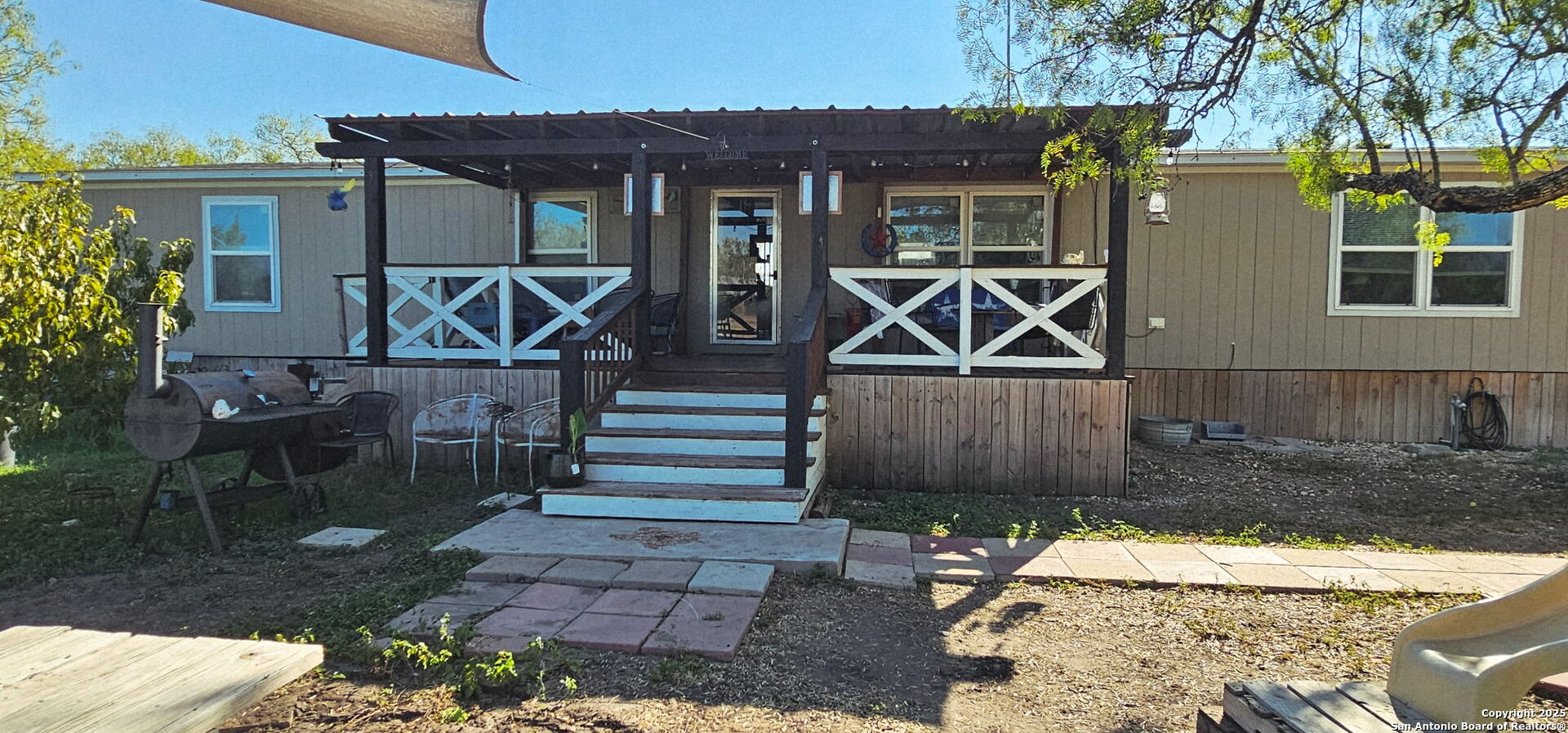 a front view of a house with garden